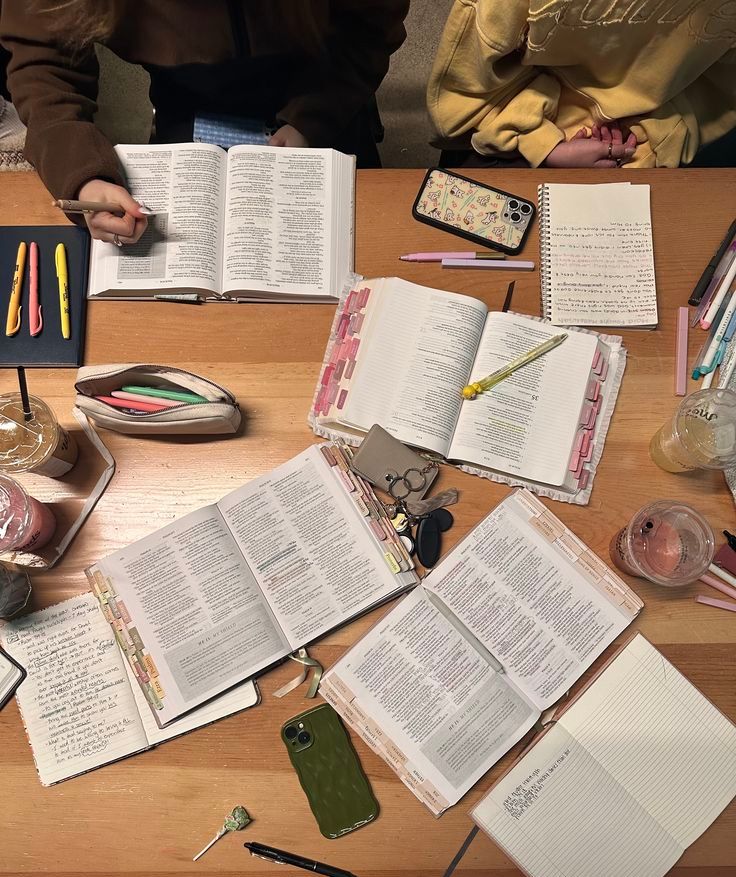 Young people with Bibles, pens and highlighters on table for a bible study
