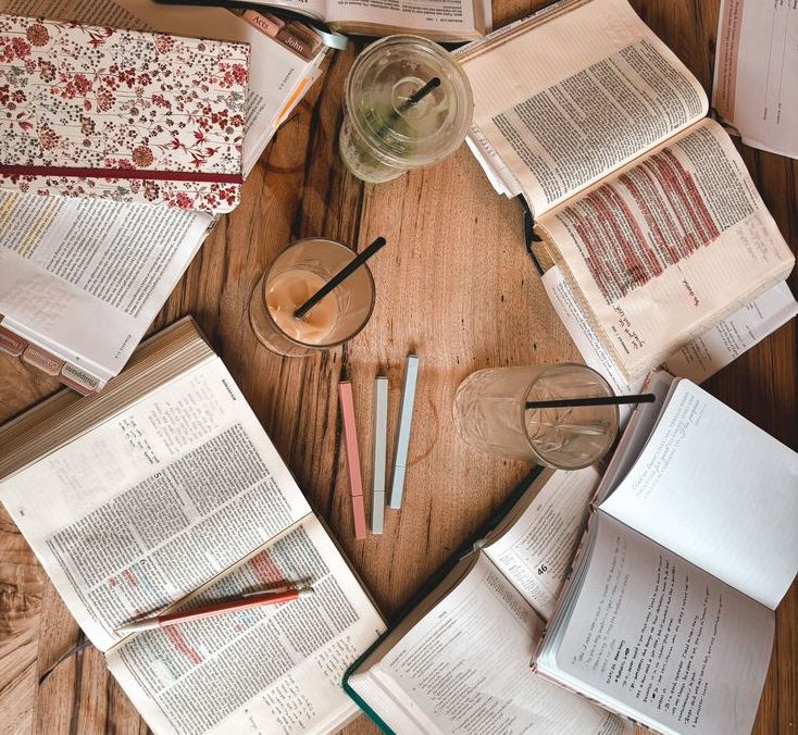 Bibles on a table with passages highlighted for a bible study