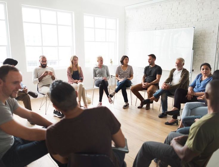 Group of people learning English in an conversation setting